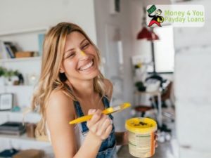 Happy Woman Painting - Budget Friendly Tips to Increase the Value of Your Home